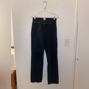 Black asymmetrical, ripped Princess Polly jeans